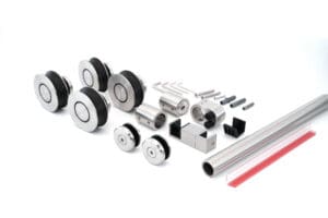 Components of a sliding door hardware kit neatly arranged.