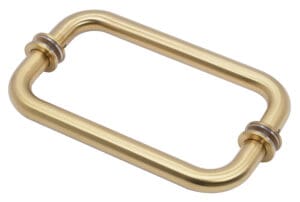 Brass door handle with a rectangular shape and rounded edges.