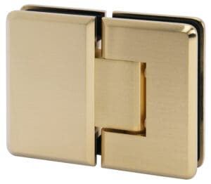 Close-up of a shiny gold-colored hinge.