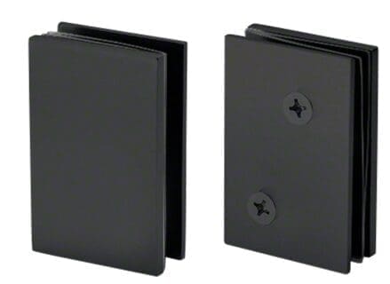 Two black plastic objects with screws, possibly electronic enclosures.