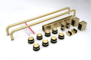 Close-up of a gold and black audio mixer control panel with knobs and sliders.