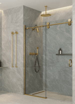 Modern bathroom with gold fixtures and glass shower door.