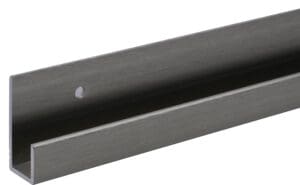 Close-up of a dark metal bar with a small white mark.