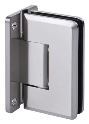 Close-up of a metallic door hinge on a wooden surface.