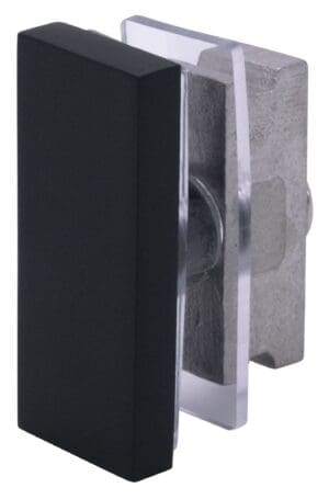 Close-up of a metal latch on a black door frame.