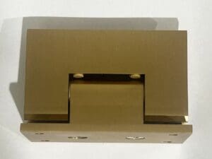 Rectangular metallic hinge on white background.